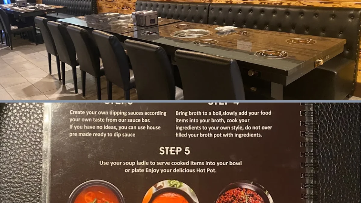 Shared table with hot pot pots and grill plates.