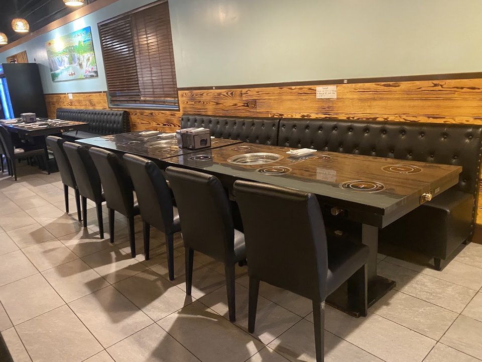 Colorful sauce bar beside a casual dining room.